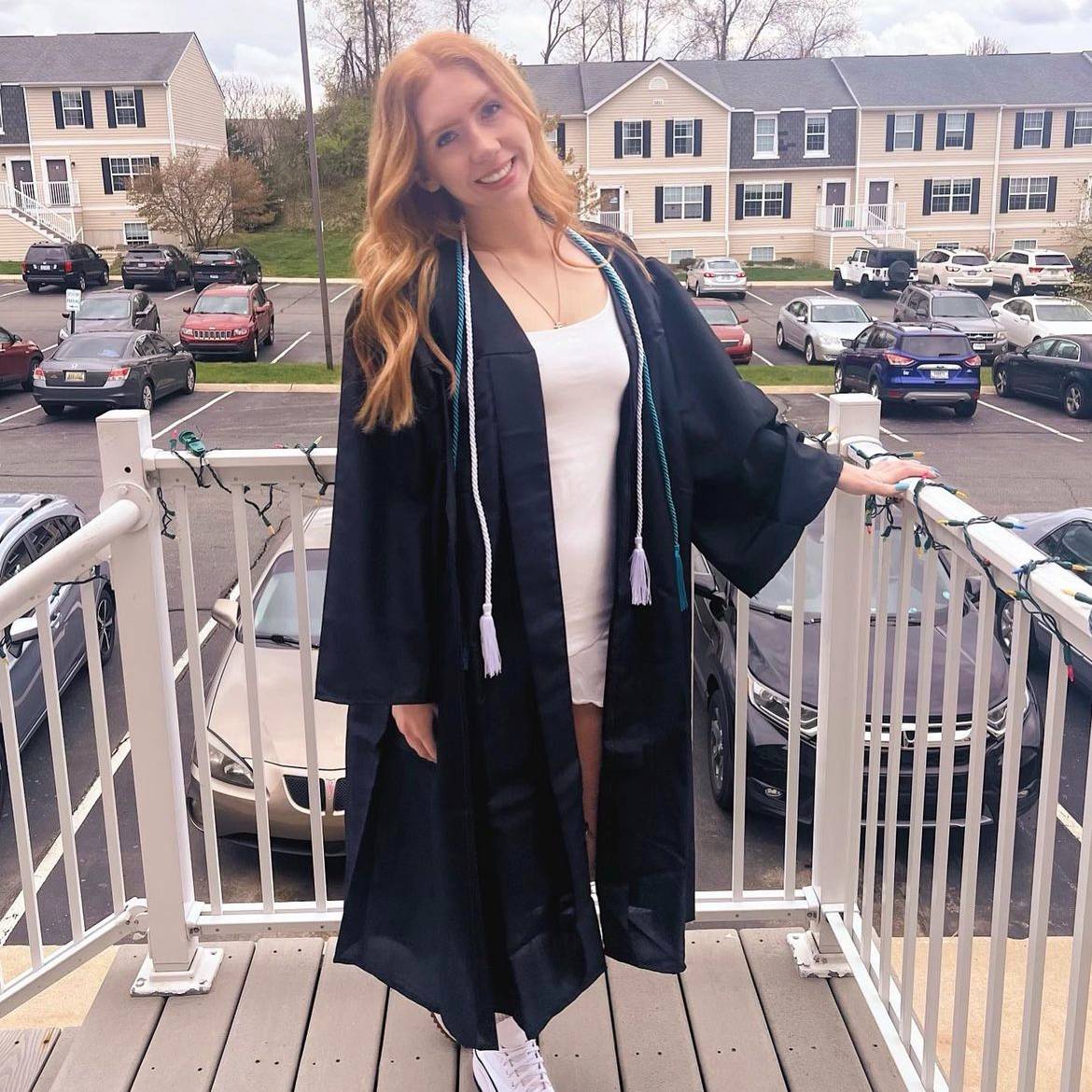 student wearing graduation gown